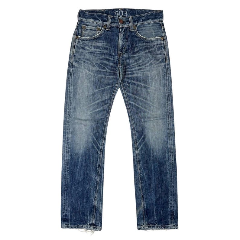 May include: Blue denim jeans with a faded wash and distressed details. The jeans have a button fly, classic five-pocket design, and a straight leg fit. The top button has the number "513" on it.