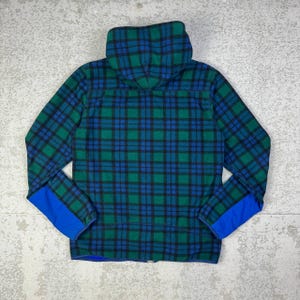 May include: A set of three ceramic mugs with a speckled, matte finish. The mugs are in shades of cream, light gray, and dark gray. Each mug has a simple, minimalist design, perfect for coffee or tea.