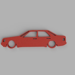 May include: A red car silhouette cutout, a simple design for a craft project or decoration.