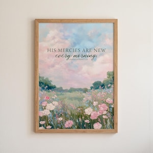 May include: A framed art print featuring a pastoral landscape with a field of pink and white flowers under a pastel sky. The text "HIS mercies are NEW every morning" is displayed in elegant script.