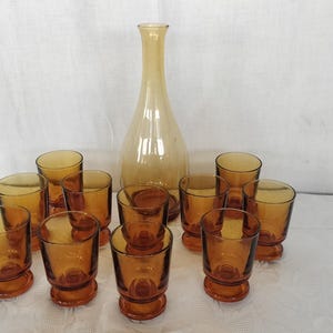 glass service with vintage bottle