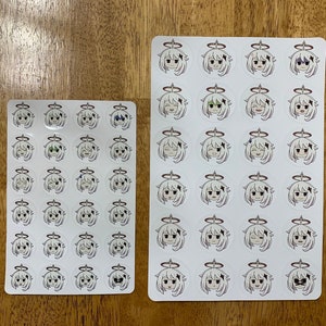 May include: Two sheets of white paper with 36 round stickers each. The stickers feature a cartoon character with white hair and different facial expressions.
