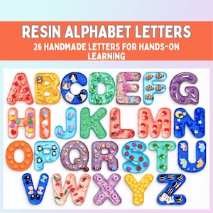 May include: A set of twenty-six resin alphabet letters featuring various embedded colorful miniature objects like fruits, animals, and shapes. The image includes the text RESIN ALPHABET LETTERS and 26 HANDMADE LETTERS FOR HANDS-ON LEARNING.