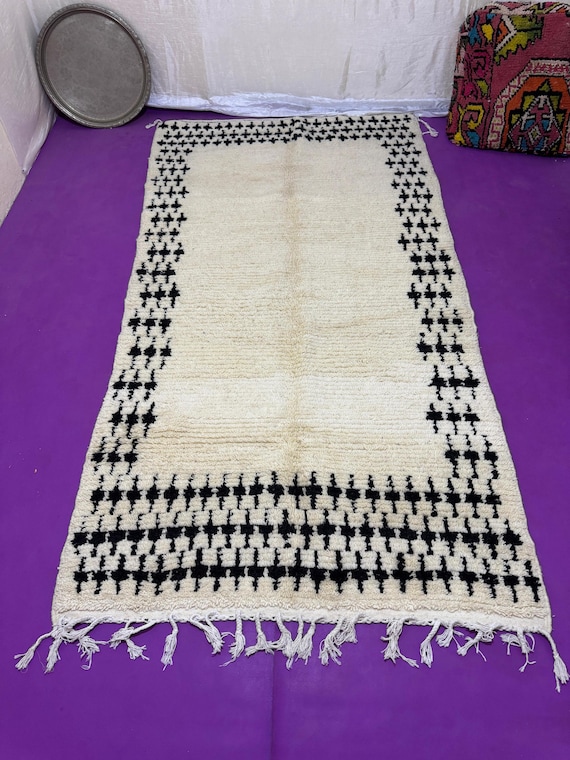 Minimalist Moroccan Rug with Ethnic Motifs Ideal for adding warmth and personality to any space