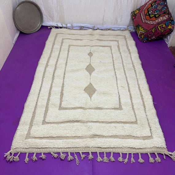Traditional Moroccan rug decorated with geometric shapes