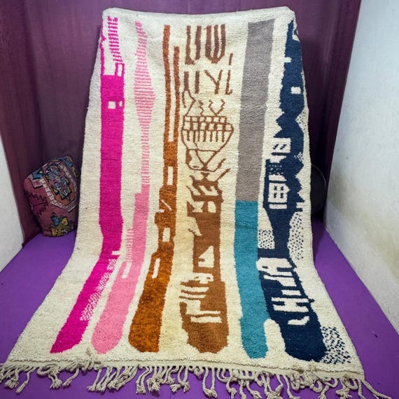 Traditional Moroccan rug decorated with geometric shapes; rugs