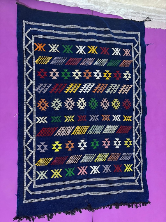 Handwoven Berber Kilim A Traditional Moroccan Rug with Geometric Amazigh Symbols on Indigo Wool