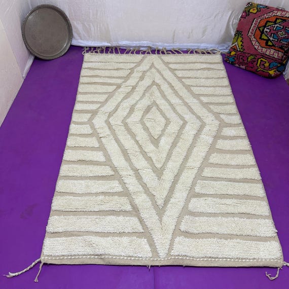 Traditional Moroccan rug decorated with geometric shapes