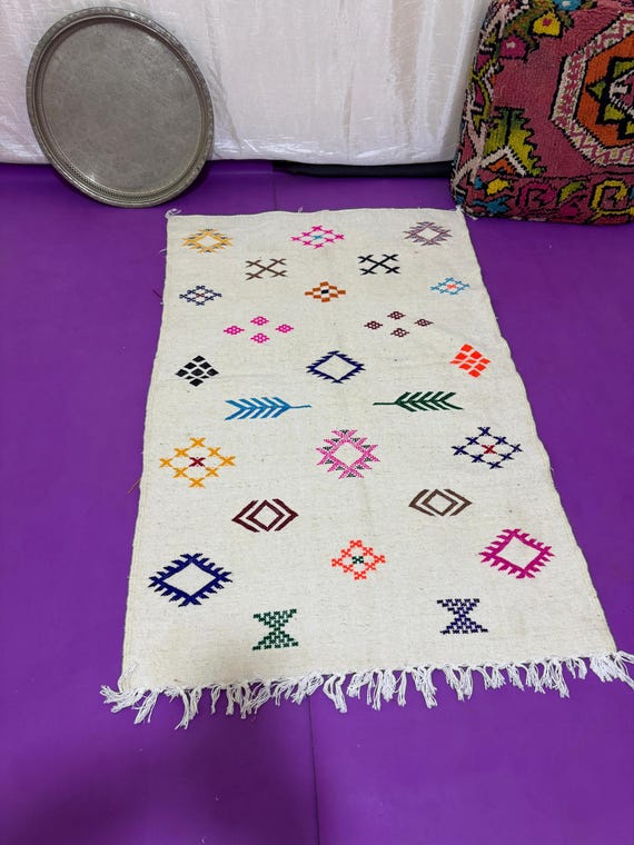 Handwoven Moroccan Berber Rug – Colorful Tribal Symbols on Soft Cream Wool | Unique Traditional Decor for Modern Spaces