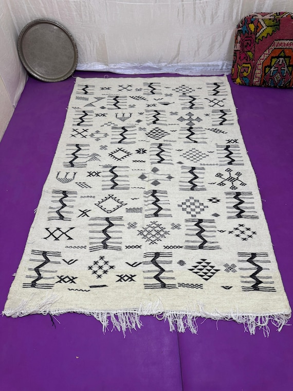 Traditional White Amazigh Kilim with Dark Geometric Embroidery