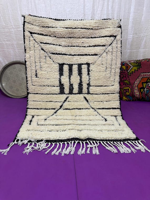 A rug with a rug... threads of grandmother's wool tell the story of the land when silence was the language of warmth.