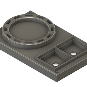 Op de afbeelding: Een grijze kunststof basis met een ronde opening en twee rechthoekige compartimenten. De basis heeft een verhoogde lip rond de opening.