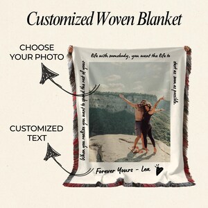 May include: A white woven blanket with a photo of a couple standing on a mountaintop. The blanket has a red and black fringe border. The text "When you realize you want to spend the rest of your life with somebody, you want the life to start as soon as possible." is printed on the blanket. The text "Forever Yours - Lea" is also printed on the blanket.
