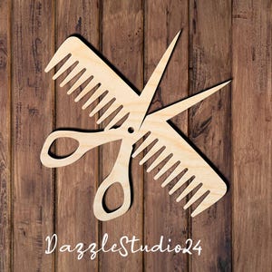 May include: Wooden cutout of a comb and scissors, overlapping each other. The scissors are in the center, with the comb on top and below. The text "DazzleStudio24" is at the bottom. The background is a wooden surface.