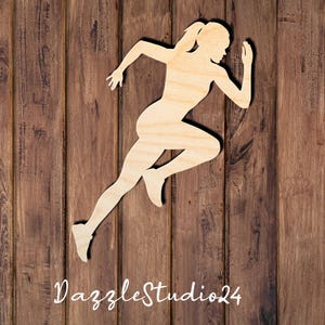 May include: A wooden cutout of a person running. The cutout is in a running pose with one leg forward and the other leg bent behind. The person's arms are bent at the elbows and their hands are clenched into fists.