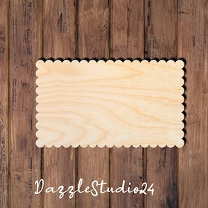 May include: A blank wooden sign with a scalloped edge. The sign is made of light wood and has a natural finish.