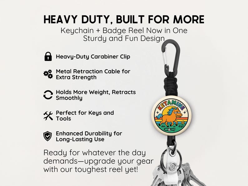 May include: A keychain and badge reel combo with a carabiner clip. The reel features a circular design with a cartoon horse and the word "KETAMINE". The text "HEAVY DUTY, BUILT FOR MORE" is at the top.