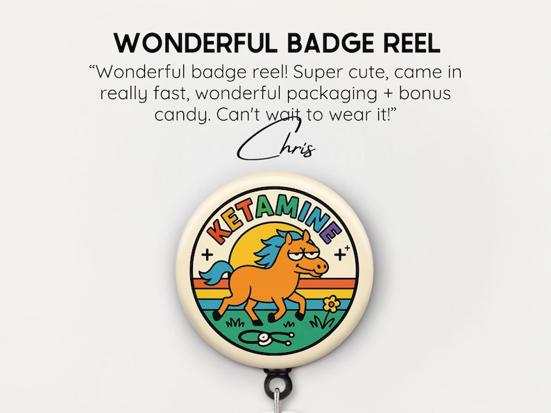 May include: A badge reel with a cartoon horse design. The badge reel has the word "KETAMINE" in a rainbow font. The horse is orange with a blue mane and tail, set against a yellow sun and green grass. The text "WONDERFUL BADGE REEL" is at the top.