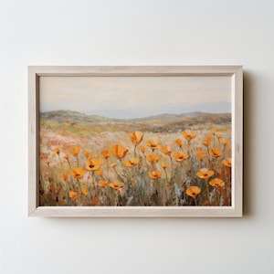 May include: A framed painting of a field of orange wildflowers with a distant mountain range in the background.