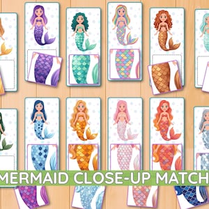 May include: A matching game featuring twelve rectangular cards, each displaying a cartoon mermaid with a unique tail colour and pattern, accompanied by twelve smaller square tiles showing a close-up of the corresponding mermaid tail scales.