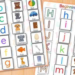 May include: Educational flashcards with the alphabet and matching images. Each card shows a letter, a picture, and the word for the image. The images include a bear, cat, dog, elephant, fish, giraffe, ball, car, door, egg, fork, and glass.
