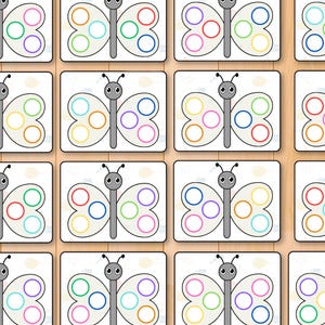 May include: A grid of butterfly-shaped cards with colorful circles on the wings. Each butterfly has a gray body and antennae. The circles are in various colors, including blue, green, yellow, and pink.