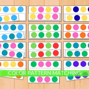 May include: Color pattern matching game featuring colorful circles on white cards. Each card has a row of five circles, with a matching strip below. The game includes various color combinations like blue, yellow, pink, and green.