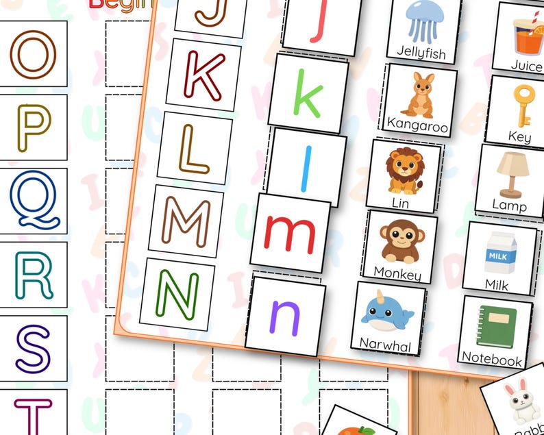 May include: Alphabet flashcards for early learning, featuring colourful letters and illustrations. Includes images of a jellyfish, kangaroo, lion, monkey, narwhal, and other objects. Ideal for teaching the alphabet.