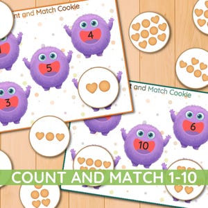 May include: Educational game with the text "Count and Match 1-10". The game features purple monster characters with numbers 1-6 and 10. Matching cookies with heart shapes are also included. The game is designed for early learning.