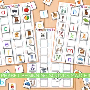 May include: Educational alphabet game featuring beginning sounds matching. The game includes letter cards and picture cards with images like a fish, ant, apple, bear, ball, dog, door, egg, fork, and giraffe.