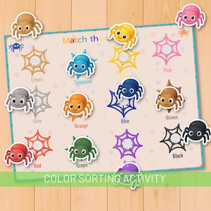 Op de afbeelding: Een kleuren sorteeractiviteitenspel met cartoon spinnen en spinnenwebben in verschillende kleuren. Het spelbord heeft de tekst "Match the" en "Color Sorting Activity". Kleuren zijn onder meer crème, turquoise, geel, roze, grijs, oranje, blauw, bruin, rood, groen, paars en zwart.