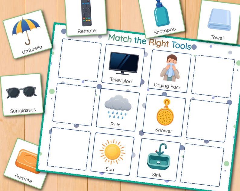 May include: A colorful educational game titled "Match the Right Tools" featuring illustrations of everyday objects like an umbrella, television, and sink. The game includes matching cards with corresponding images and labels for each item.