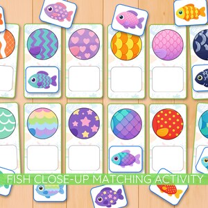 May include: A colorful matching game featuring illustrated fish. The game includes rectangular cards with patterned circles and matching fish cards. The text "FISH CLOSE-UP MATCHING ACTIVITY" is displayed at the bottom. The game is designed for educational purposes.