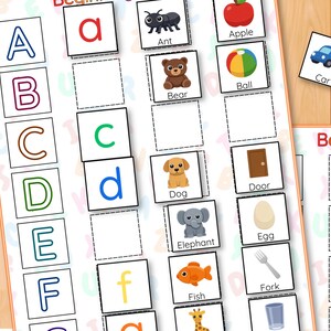 May include: An educational alphabet game with letter tiles and picture cards. Features images of an ant, apple, bear, ball, car, dog, door, elephant, egg, fish, and fork. Letters A to F are displayed.