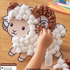 May include: A craft activity featuring a printed ram cutout with white cotton balls on the body and brown cotton balls on the horns. The text reads Abraham and Isaac, God provides a ram, sparing Isaac, and includes instructions for gluing cotton balls.