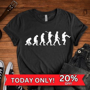 Monty Python Silly Walk T-Shirt: Evolution des Mannes Grafik-T-Shirt