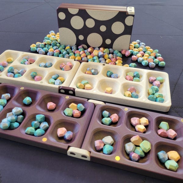 Conjunto Mancala: tablero magnético plegable y gemas