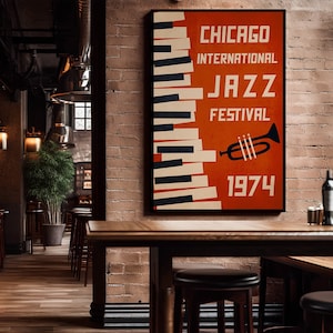May include: A framed poster for the Chicago International Jazz Festival 1974, featuring a piano keyboard design and a trumpet illustration on an orange background. The poster is displayed on a brick wall in a dimly lit bar setting with wooden tables and stools.