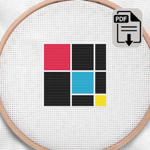 May include: A cross-stitch design featuring a geometric pattern of red, black, blue, and yellow squares. The design is set within a wooden embroidery hoop. A PDF icon is in the upper right corner.