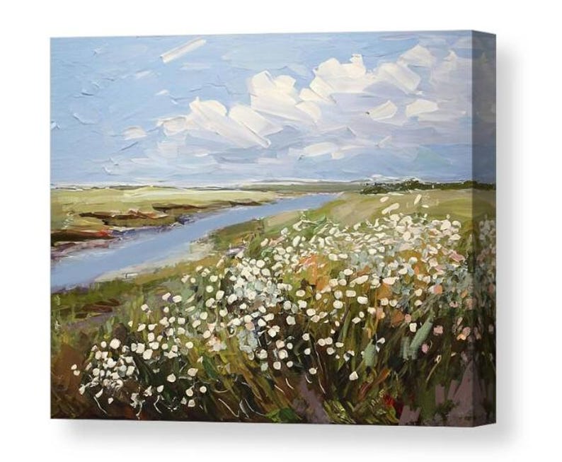 May include: An oil painting on canvas showing a tranquil landscape. A blue river meanders through green fields, beneath a sky with fluffy white clouds. White wildflowers bloom in the foreground, adding texture and contrast.