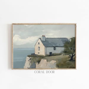 May include: A painting of a white house with a gray roof on a cliff overlooking a body of water. The house has a small porch and a few windows. The sky is cloudy and the water is a light blue.