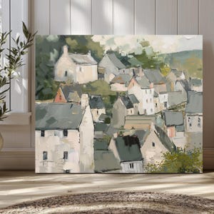 May include: An abstract painting of a village nestled in a valley. The artwork features a collection of buildings with white and gray walls and dark green roofs. The painting has a soft, muted color palette with a focus on greens and whites.