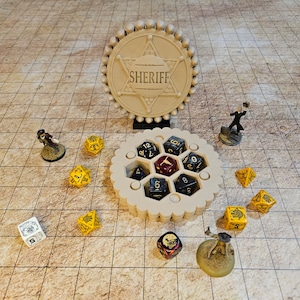 May include: A beige wooden dice tower with a hexagonal design and a sheriff's badge on top. The tower has six compartments for dice, and there are several dice scattered around it. The dice are red, black, and yellow.