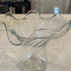 Vintage Anchor Hocking clear vase with swirled pattern on the bottom with ruffled edges.