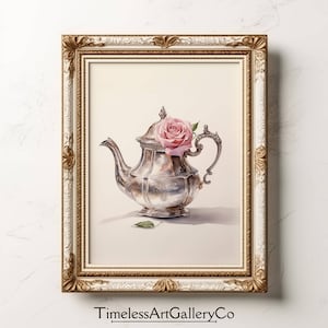 May include: A silver teapot with a pink rose on top, in a white and gold frame.