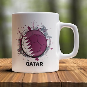 Qatar Soccer Mug for Qatarian Soccer Fans. Makes a great soccer gift for your favorite soccer fan or soccer player. Cheer on the Soccer World Cup or Olympic Soccer with this colorful soccer mug.