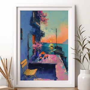 May include: A painting of a colorful sunset over a body of water with a small boat in the distance. A table with a bowl of fruit and a chair are in the foreground. The scene is framed by a white wall and a white frame.