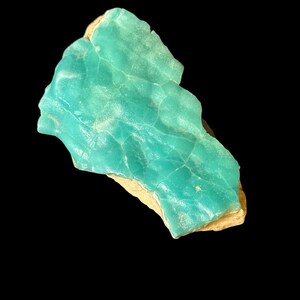 High quality Blue Aragonite on matrix specimen from Crazy Ohio Crystals, weighing 150 grams and measuring 3.5 inches wide, showcasing vibrant aqua-blue crystals on natural earthy base.