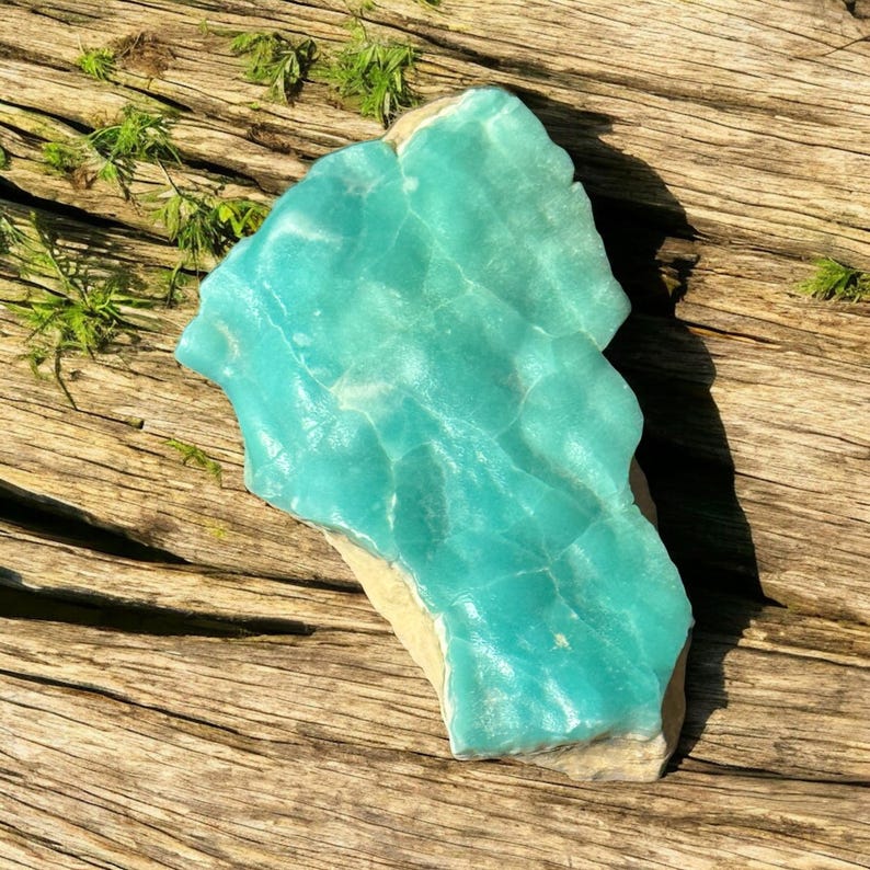 High quality Blue Aragonite on matrix specimen from Crazy Ohio Crystals, weighing 150 grams and measuring 3.5 inches wide, showcasing vibrant aqua-blue crystals on natural earthy base.