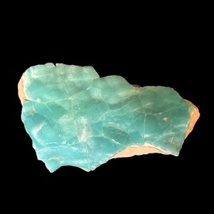 High quality Blue Aragonite on matrix specimen from Crazy Ohio Crystals, weighing 150 grams and measuring 3.5 inches wide, showcasing vibrant aqua-blue crystals on natural earthy base.